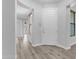 Bright foyer with wood-style flooring, a coat closet, and neutral paint at 4777 S Fulton Ranch Blvd # 1029, Chandler, AZ 85248