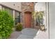 Inviting entryway with a stylish front door, stone accents, and lush landscaping at 4777 S Fulton Ranch Blvd # 1029, Chandler, AZ 85248