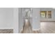 Hallway leading to living areas with hardwood floors and neutral walls at 4777 S Fulton Ranch Blvd # 1029, Chandler, AZ 85248