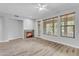 Living room featuring a ceiling fan, fireplace, recessed lighting and sliding doors at 4777 S Fulton Ranch Blvd # 1029, Chandler, AZ 85248