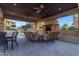 Cozy outdoor seating area with a stone fireplace, perfect for relaxing evenings and entertaining guests at 4777 S Fulton Ranch Blvd # 1029, Chandler, AZ 85248