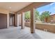 Covered patio with stone accent wall and view of landscaping at 4777 S Fulton Ranch Blvd # 1029, Chandler, AZ 85248