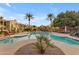 Resort-style community pool with palm trees, lounge chairs, and ample space for relaxation and enjoyment at 4777 S Fulton Ranch Blvd # 1029, Chandler, AZ 85248