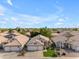 Charming home with well-manicured lawn in a serene neighborhood, showcasing curb appeal and community ambiance at 4809 W Erie St, Chandler, AZ 85226