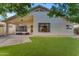 Inviting backyard featuring a covered patio, artificial grass, and ample space for outdoor living and entertaining at 4809 W Erie St, Chandler, AZ 85226