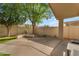 Serene backyard featuring a patio, lush trees, and a well-maintained lawn, great for relaxation at 4809 W Erie St, Chandler, AZ 85226