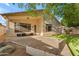 Large, landscaped backyard with patio, grassy area, and mature trees perfect for outdoor living at 4809 W Erie St, Chandler, AZ 85226