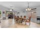 Spacious dining area with ample natural light, complete with elegant dining table, chairs, and ceiling fan at 4809 W Erie St, Chandler, AZ 85226