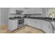 Bright kitchen featuring white cabinetry, stainless steel appliances, and ample counter space for cooking at 4809 W Erie St, Chandler, AZ 85226