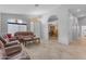 Inviting living room with tile floors, neutral walls, and classic leather furniture, a perfect setting for entertaining at 4809 W Erie St, Chandler, AZ 85226