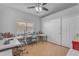 Versatile bonus room with wood floors, ceiling fan, a large window and closet space at 4809 W Erie St, Chandler, AZ 85226