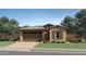 Charming single story home with a two car garage, tile roof, and low maintenance front yard at 5043 S 233Rd Dr, Buckeye, AZ 85326