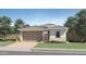 Charming single-story home with a two-car garage, neutral color palette and neatly landscaped front yard at 5075 S 233Rd Dr, Buckeye, AZ 85326
