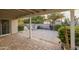 Covered patio with brick pavers, firepit and string lights for a relaxing atmosphere at 5206 S Clark Dr, Tempe, AZ 85283