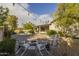 Backyard with outdoor seating area, playhouse, firepit and desert landscaping. Perfect for relaxing! at 5206 S Clark Dr, Tempe, AZ 85283