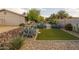 Beautiful desert landscaped backyard with artificial turf and rock accents at 5206 S Clark Dr, Tempe, AZ 85283
