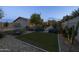 Backyard with desert landscaping and artificial turf at 5206 S Clark Dr, Tempe, AZ 85283