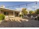 Backyard patio with brick pavers, firepit and Adirondack chairs, perfect for entertaining at 5206 S Clark Dr, Tempe, AZ 85283