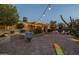 Backyard patio with string lights, a small play structure, and ample space at 5206 S Clark Dr, Tempe, AZ 85283