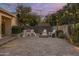 Wide backyard view featuring patio, playset, fire pit, string lights at 5206 S Clark Dr, Tempe, AZ 85283