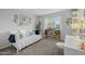 Bright bedroom with a daybed, white desk and chair with view to the outside at 5206 S Clark Dr, Tempe, AZ 85283