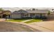 Beautiful residence with a pristine lawn, paved walkway, and desert-friendly plants at 5206 S Clark Dr, Tempe, AZ 85283