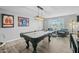 Entertaining game room featuring a pool table, sports memorabilia, and comfortable seating area at 5206 S Clark Dr, Tempe, AZ 85283