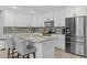Modern kitchen featuring white cabinets, granite countertops, and stainless-steel appliances at 5206 S Clark Dr, Tempe, AZ 85283