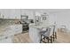 Bright kitchen features white cabinets, stainless appliances, granite counters and a breakfast bar with seating at 5206 S Clark Dr, Tempe, AZ 85283