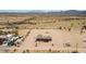 Extensive desert property featuring an expansive lot, outbuildings and a charming single-story home at 54463 W Sunburst St, Maricopa, AZ 85139