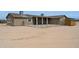 View of a fenced yard and covered patio attached to a single-story desert property at 54463 W Sunburst St, Maricopa, AZ 85139
