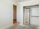 Bedroom featuring gray concrete floors and closet with mirrored door at 54463 W Sunburst St, Maricopa, AZ 85139