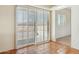 This is a well lit room with sliding glass doors at 54463 W Sunburst St, Maricopa, AZ 85139