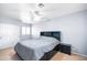 Bright bedroom with a ceiling fan, closet, and window, providing a serene and inviting space at 5513 E Grovers Ave, Scottsdale, AZ 85254