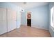 Bedroom featuring hardwood floors, closet with sliding doors, and a bathroom with a view of a vanity at 5513 E Grovers Ave, Scottsdale, AZ 85254