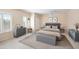 This bedroom features neutral walls, light-colored carpet, and gray furniture for a modern and soothing aesthetic at 5513 E Grovers Ave, Scottsdale, AZ 85254