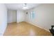 Bright bedroom with wood floors, shuttered window, and modern furniture at 5513 E Grovers Ave, Scottsdale, AZ 85254