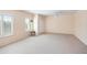 Expansive bedroom with neutral carpet and multiple windows featuring stylish white shutters at 5513 E Grovers Ave, Scottsdale, AZ 85254