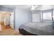Inviting bedroom features a ceiling fan, closet, and window, creating a comfortable and relaxing retreat at 5513 E Grovers Ave, Scottsdale, AZ 85254
