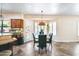 Bright dining area with large windows, an elegant chandelier, and comfortable seating, ideal for Gathering meals at 5513 E Grovers Ave, Scottsdale, AZ 85254