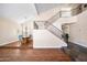 Elegant foyer with high ceilings, a staircase with iron railings, and a wood/tile floor that creates a grand entrance at 5513 E Grovers Ave, Scottsdale, AZ 85254
