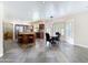 Bright kitchen with stainless steel appliances, peninsula, tile floors, and breakfast nook at 5513 E Grovers Ave, Scottsdale, AZ 85254
