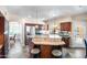 Stylish kitchen featuring granite countertops, stainless steel appliances, and a breakfast bar with seating at 5513 E Grovers Ave, Scottsdale, AZ 85254