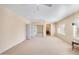 A spacious primary bedroom with neutral carpet flooring, white shutters, and ensuite bath access at 5513 E Grovers Ave, Scottsdale, AZ 85254