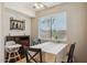 Cozy dining area with a table, chairs, and natural light from a window at 5808 E Brown Rd # 140, Mesa, AZ 85205