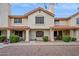 Inviting two-story townhouse featuring a red tile roof and a well-maintained stucco facade at 5808 E Brown Rd # 140, Mesa, AZ 85205