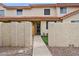 Charming townhouse entrance with courtyard and gated walkway at 5808 E Brown Rd # 140, Mesa, AZ 85205