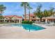 Community pool area with lounge chairs and manicured landscaping at 5808 E Brown Rd # 140, Mesa, AZ 85205