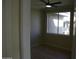 Bedroom with neutral walls, vinyl flooring, and a window overlooking greenery at 7009 E Acoma Dr # 2013, Scottsdale, AZ 85254