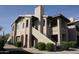 A well-kept apartment building featuring covered staircases and lush, mature landscaping at 7009 E Acoma Dr # 2013, Scottsdale, AZ 85254
